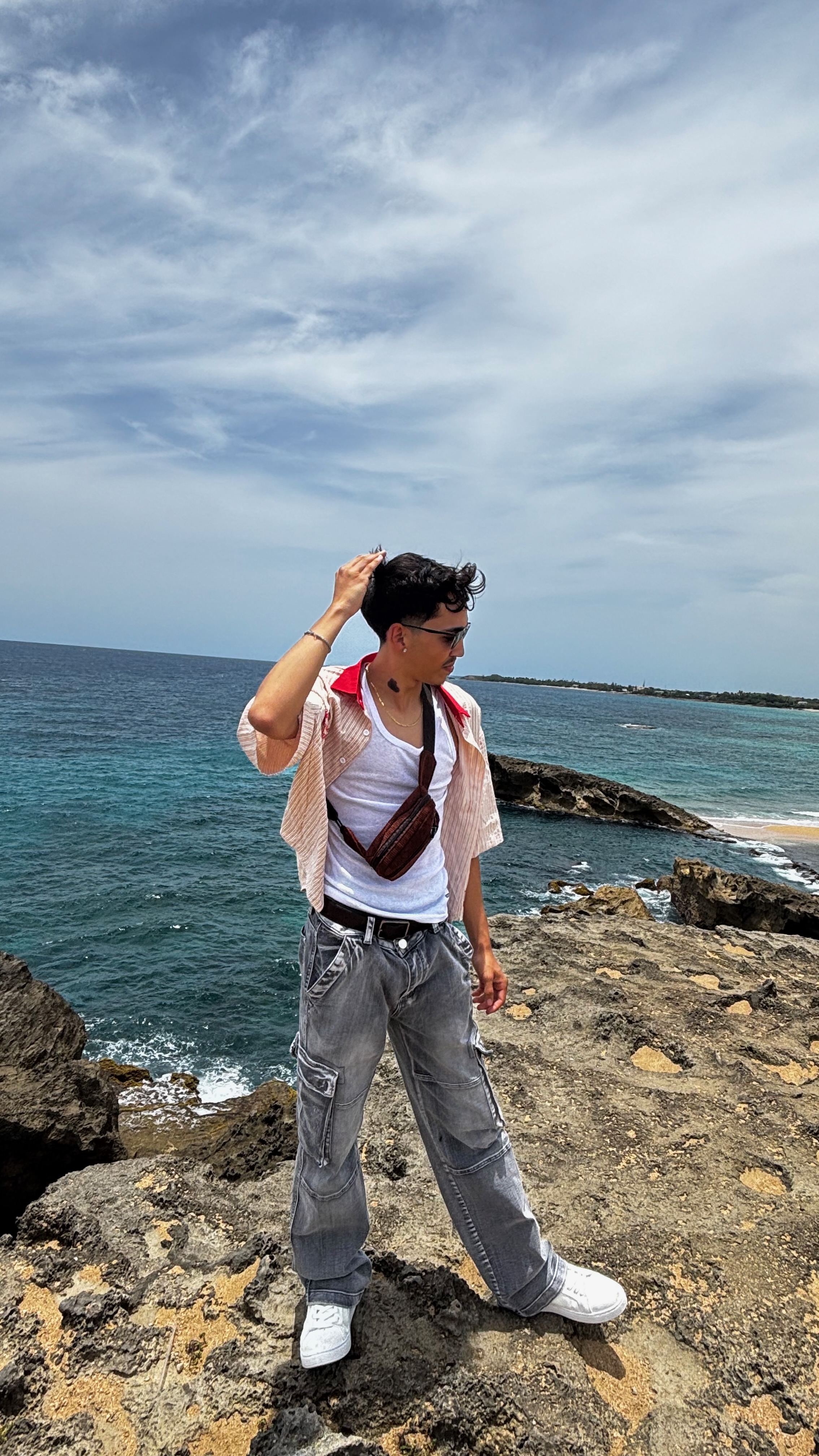 Josiah on the rocky coast in Puerto Rico